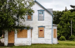 What does a house in foreclosure mean